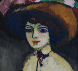 Mujer elegante vestida de negro con sombrero y perro pequeño en una plaza parisina. Obra de Van Dongen.